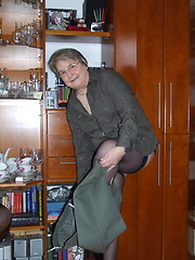 Granny dressed stockings and posing before our camera