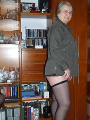 Granny dressed stockings and posing before our camera
